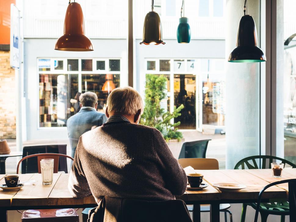Free Image of Senior man sitting alone in a caf? 
