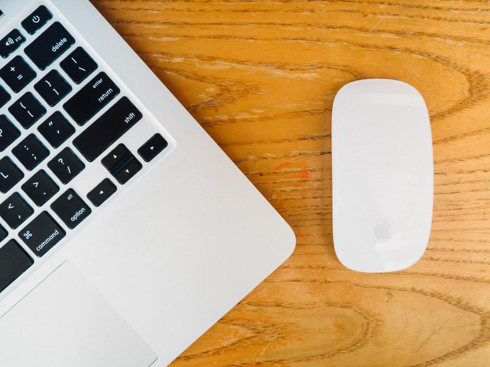 Free Image of Apple laptop keyboard and mouse on wood 