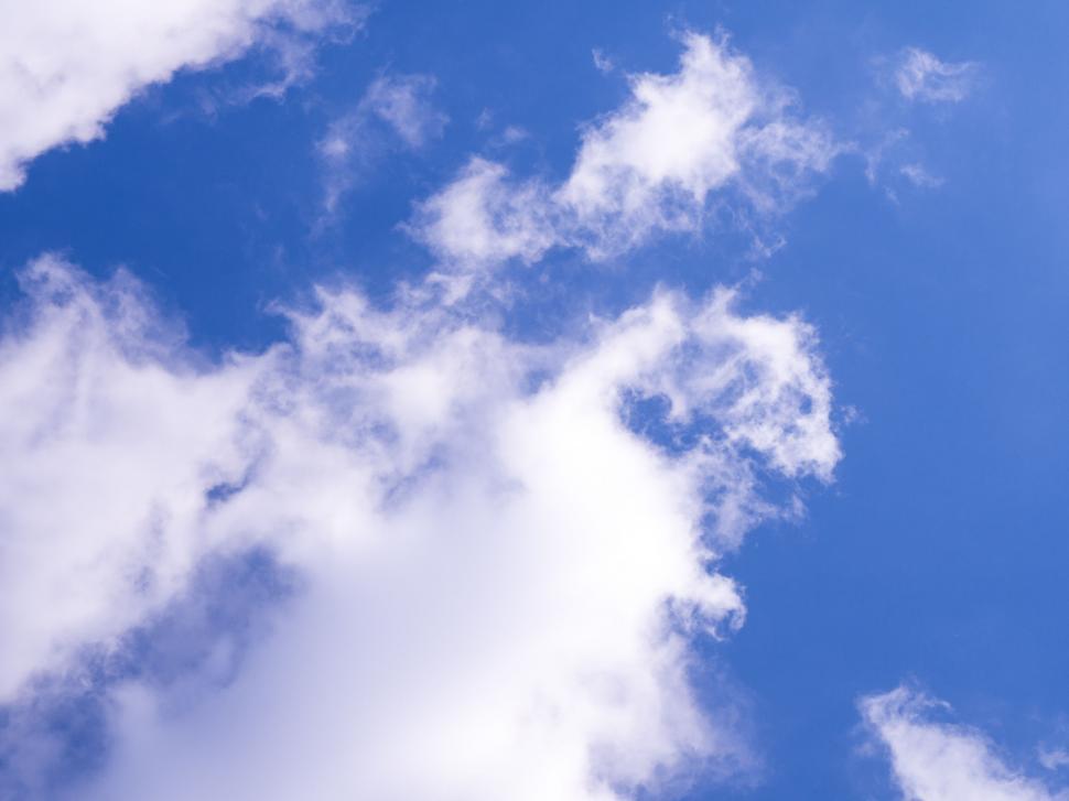 Free Image of White clouds against a blue sky backdrop 