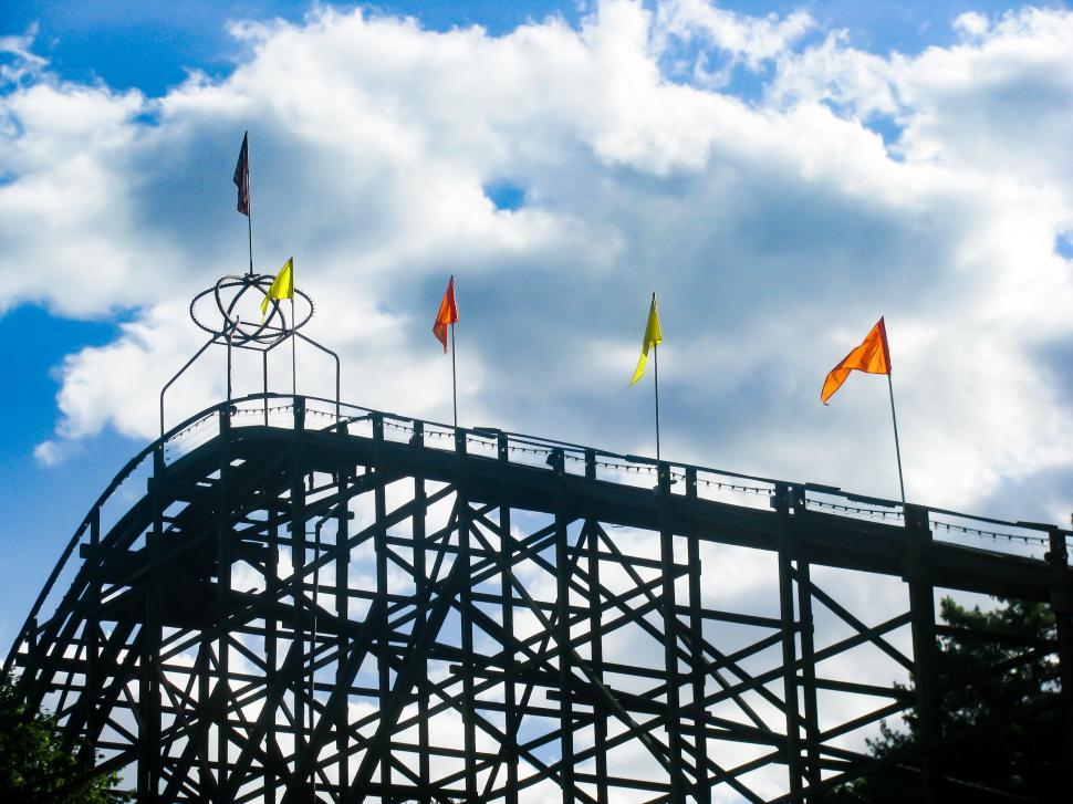 Free Image of Wooden roller coaster silhouette against sky 