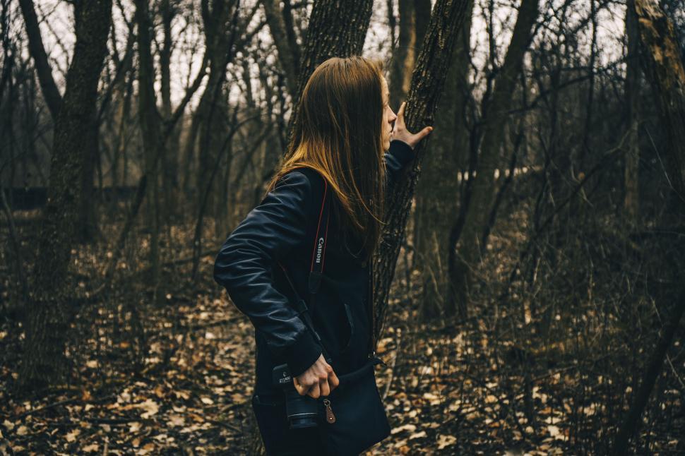 Free Image of Woman with black leather bag in forest 