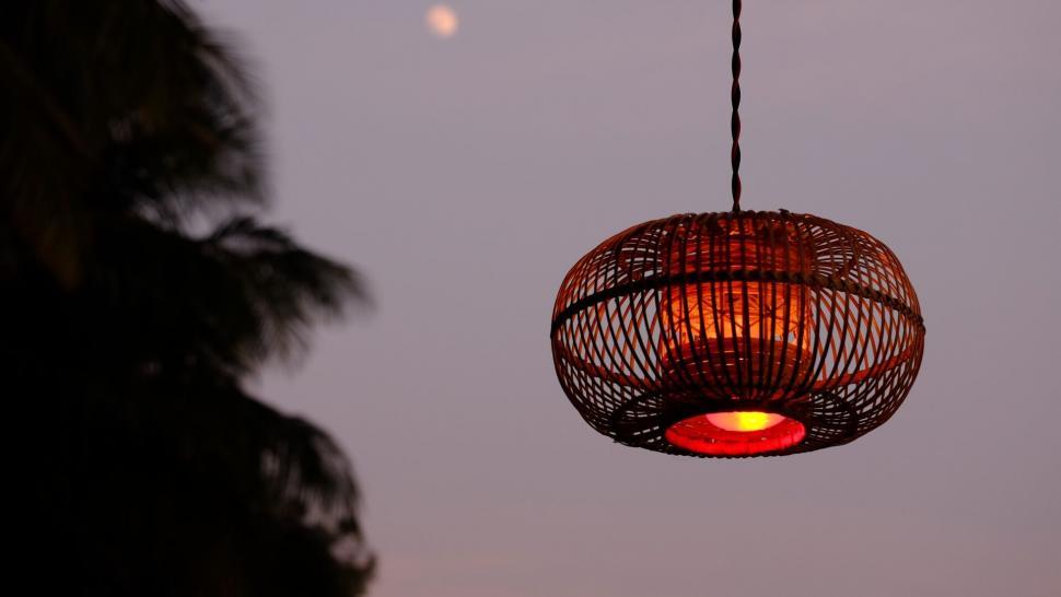 Free Image of Hanging lamp against evening sky 