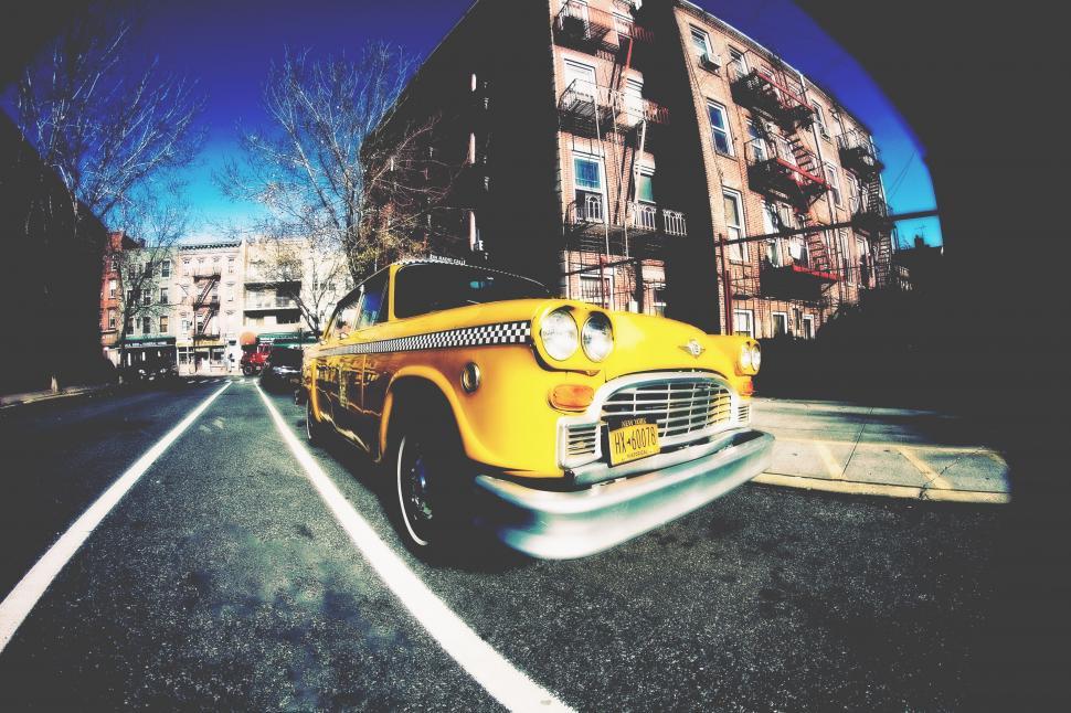 Free Image of Retro yellow taxi on urban street 