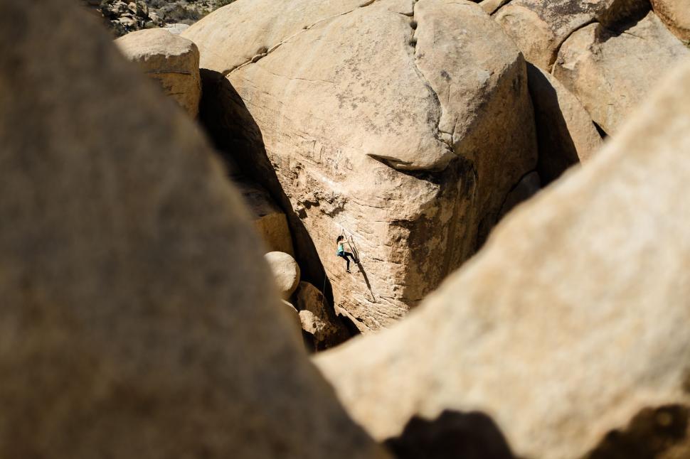 Free Image of Rocky terrain with a distant climber 