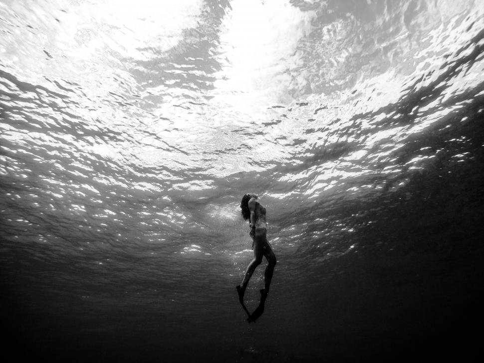 Free Image of Underwater black and white photo of a diver 