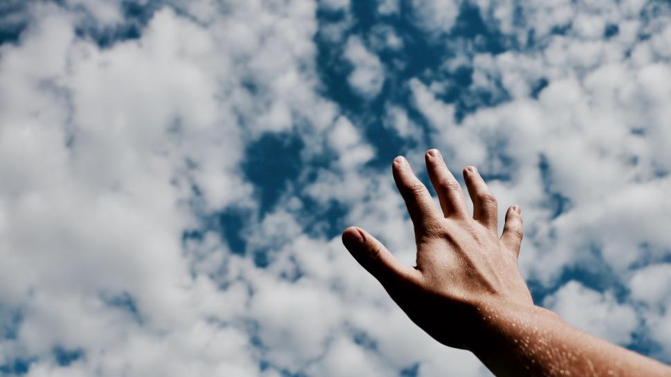 Free Image of Reach for the sky with a single hand 