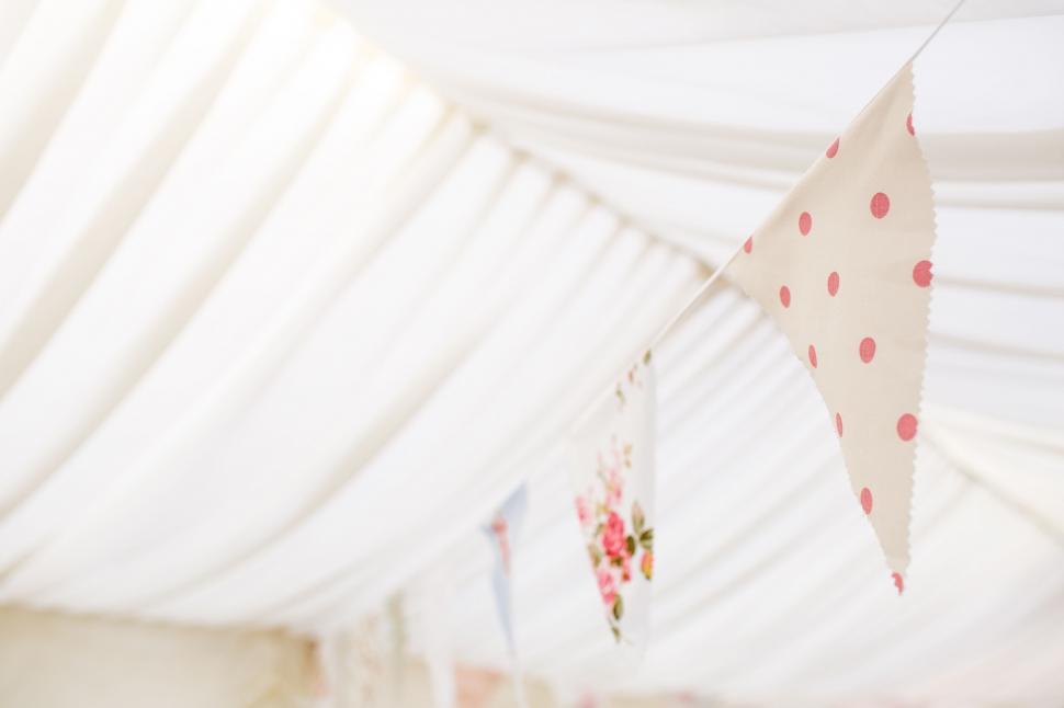 Free Image of Decorative bunting flags in marquee tent 