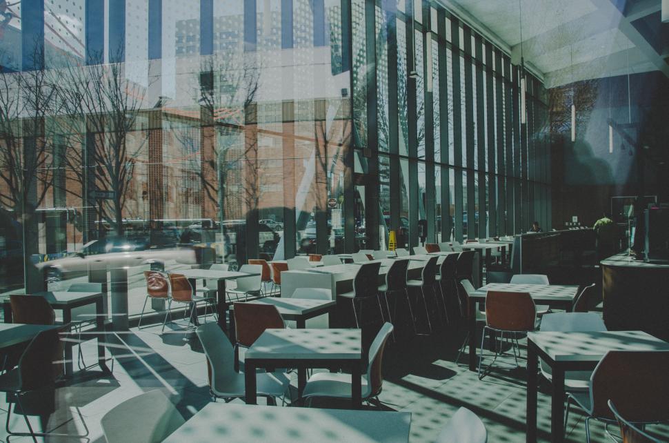 Free Image of Modern cafe interior with sunlight reflections 