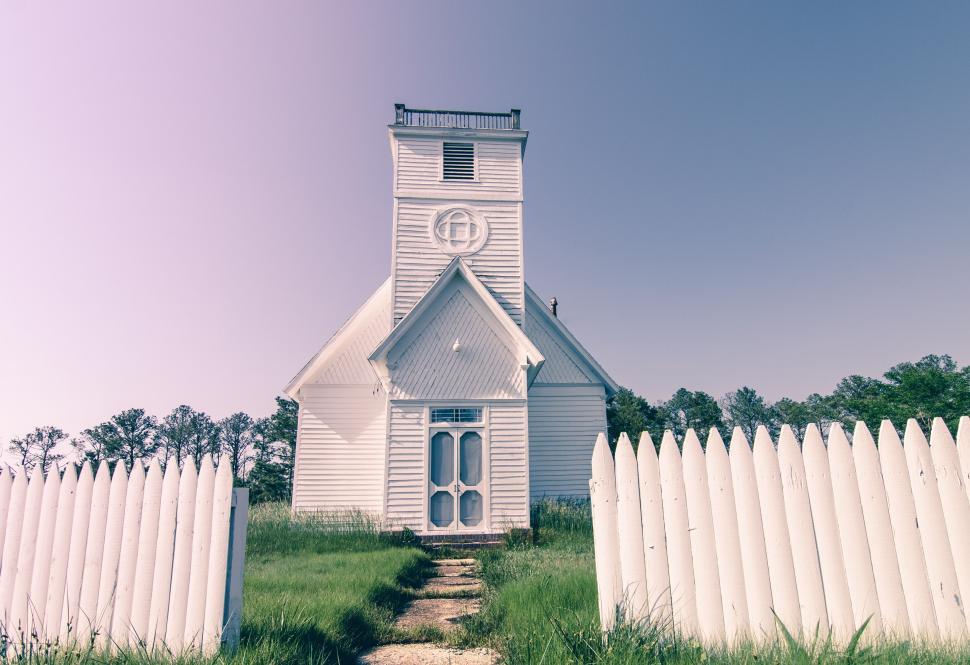 Free Image of Vintage white church with picket fence 