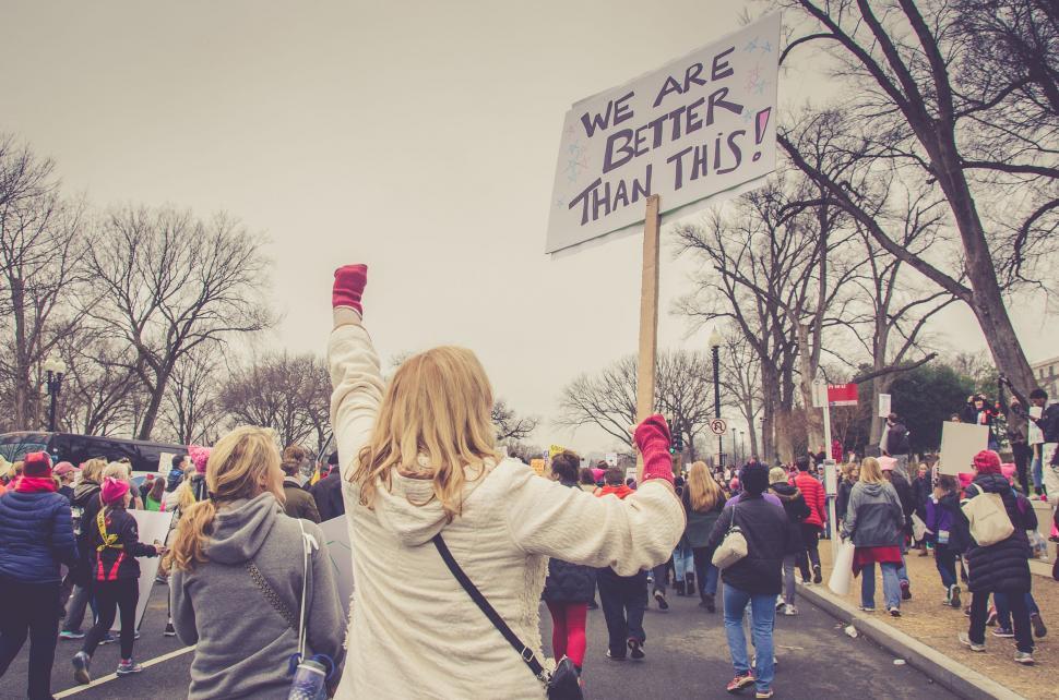 Free Image of Protest march with people holding up signs 