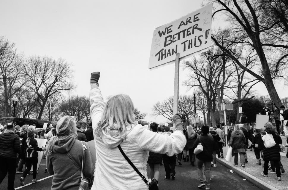 Free Image of Monochrome rally with raised fists and sign 