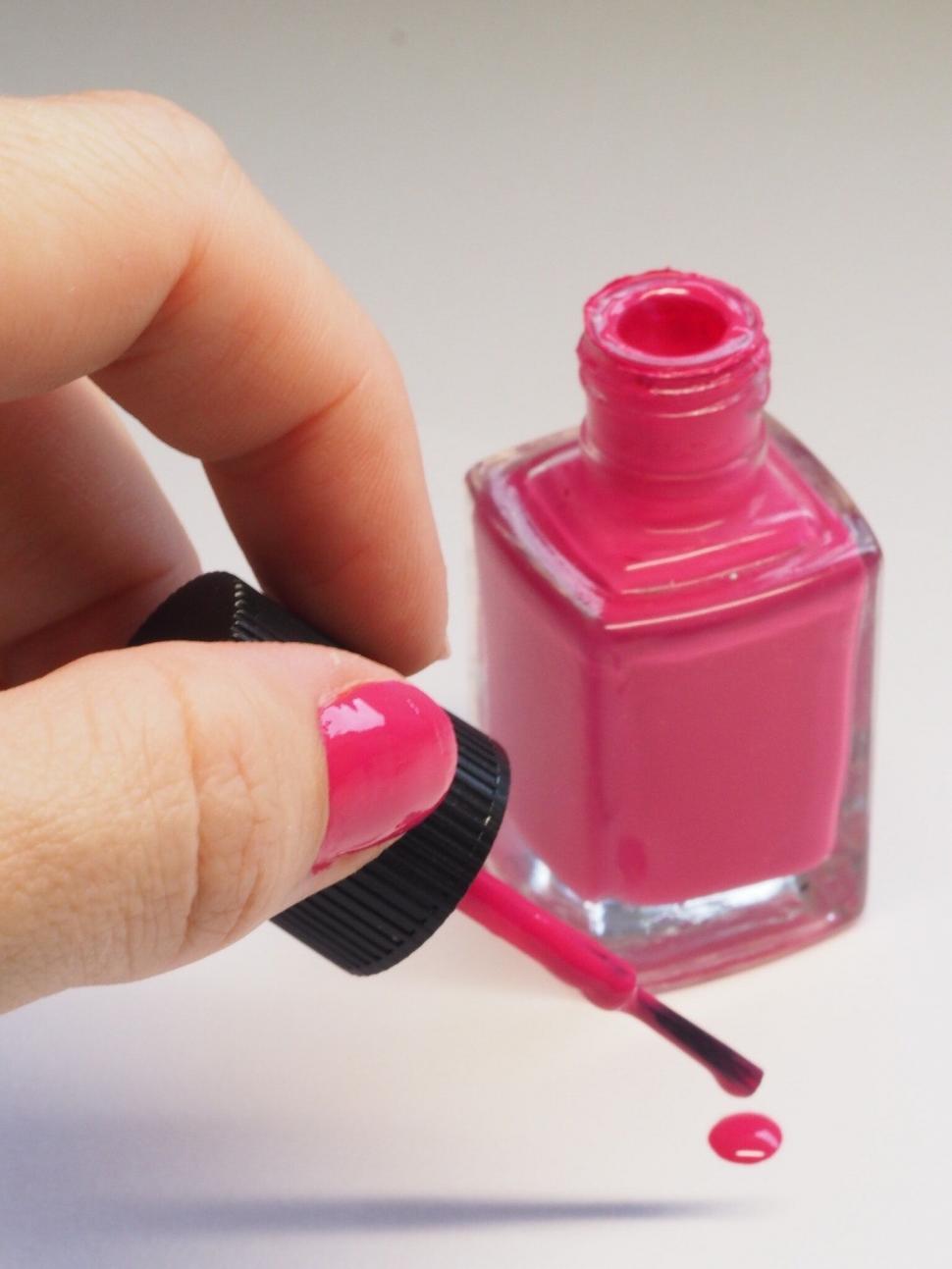 Free Image of Open pink nail polish bottle closeup 