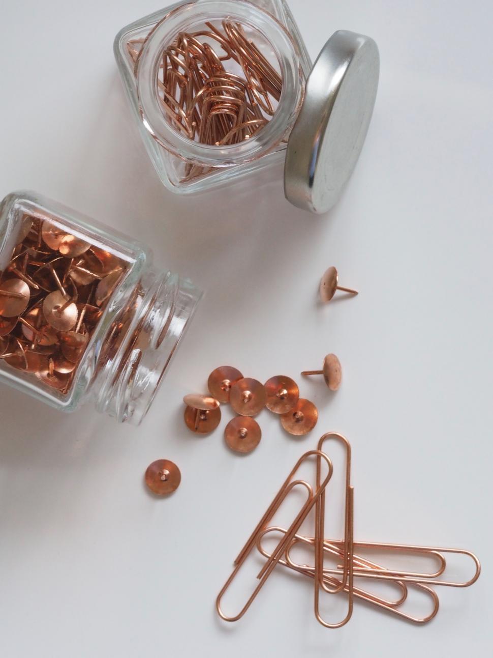 Free Image of Copper paper clips and buttons in jars 