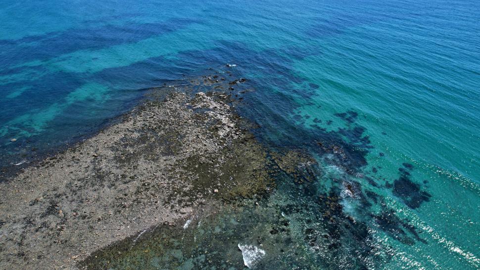 Free Image of Aerial view of rocky sea coastline 