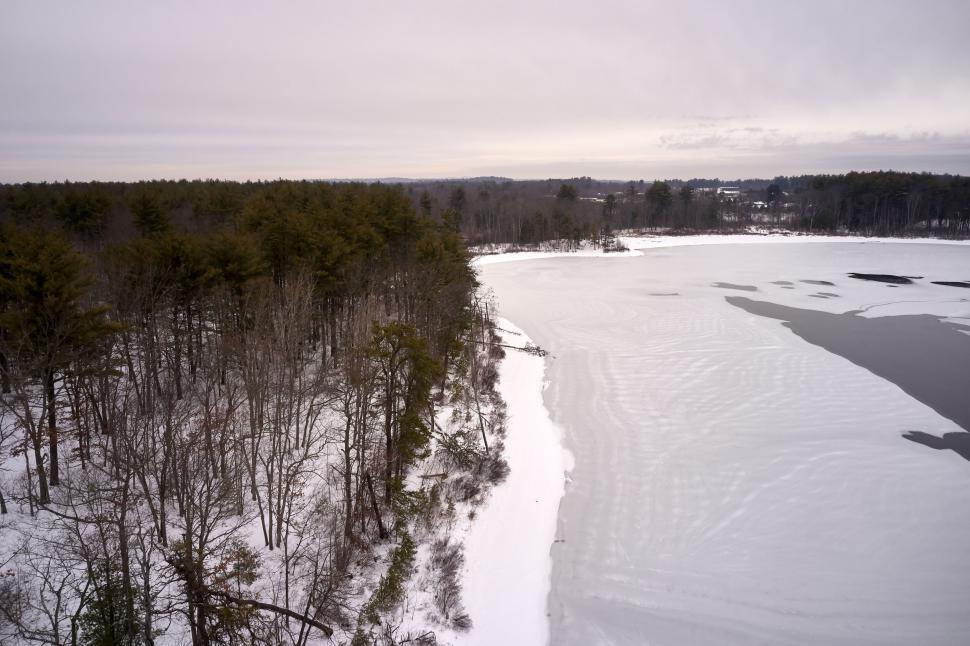 Free Image of Snowy river landscape with forest 