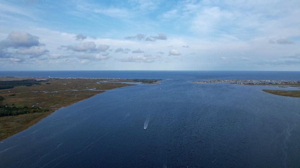 Free Image of Aerial view of river and speedboat 