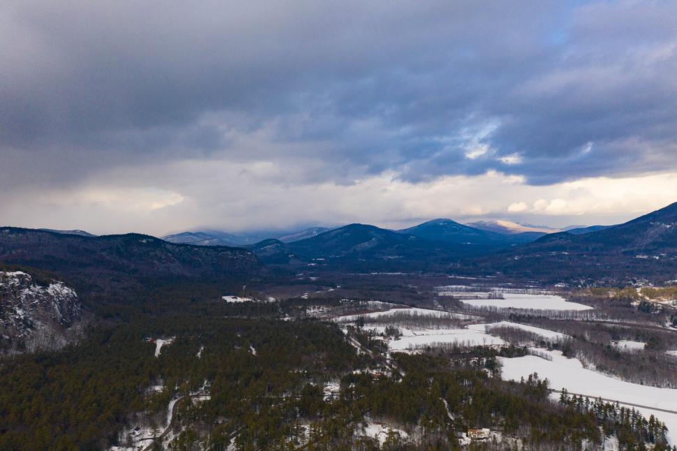 Free Image of Snowy mountain landscape with cloudy sky 