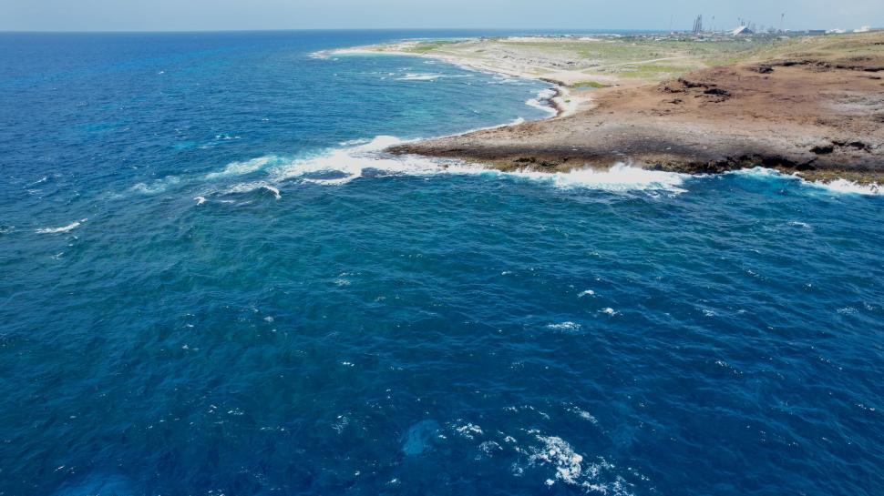 Free Image of Coastal waters with rocky shoreline 