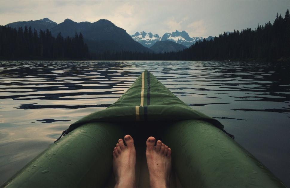 Free Image of POV in kayak on tranquil mountain lake 