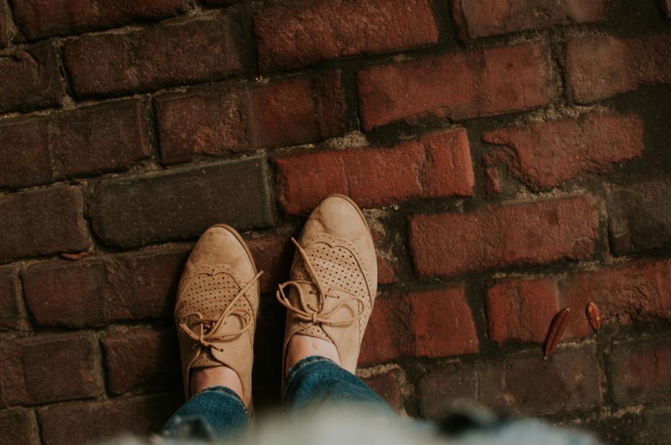 Free Image of Person Viewing Red Brick Pavement 