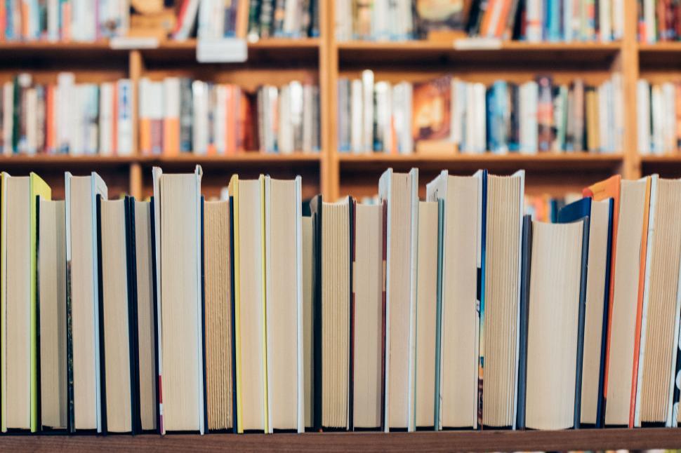 Free Image of Rows of books on a shelf in library 