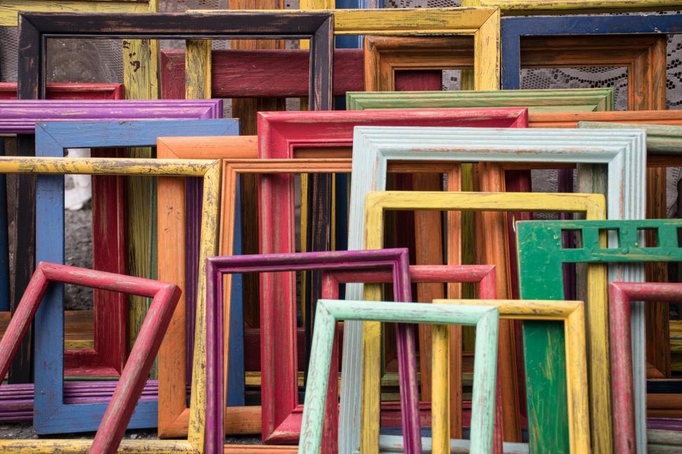 Free Image of Stack of colorful vintage picture frames 