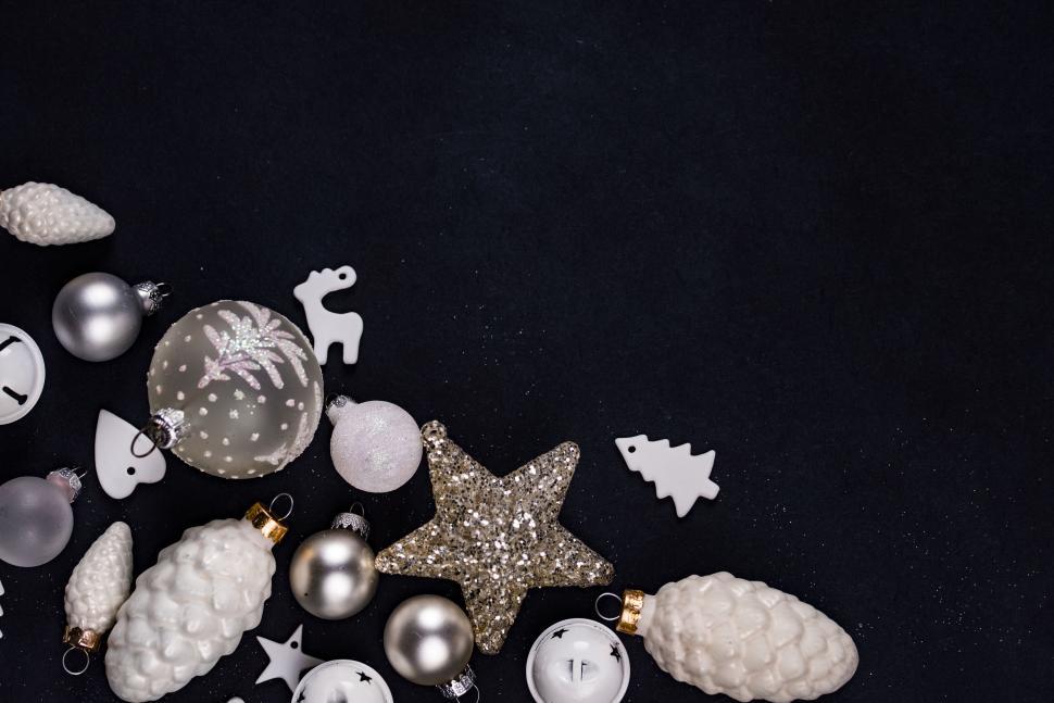 Free Image of Various Christmas ornaments arranged on dark background 