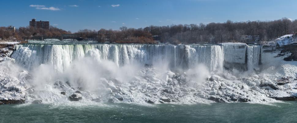 Free Image of Panoramic view of a cascading waterfall in winter time. 