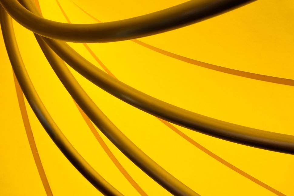 Free Image of Abstract view of black curves on a bright yellow background 