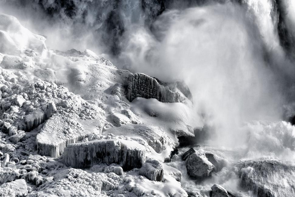 Free Image of Frozen landscape with icy terrain and misty atmosphere 