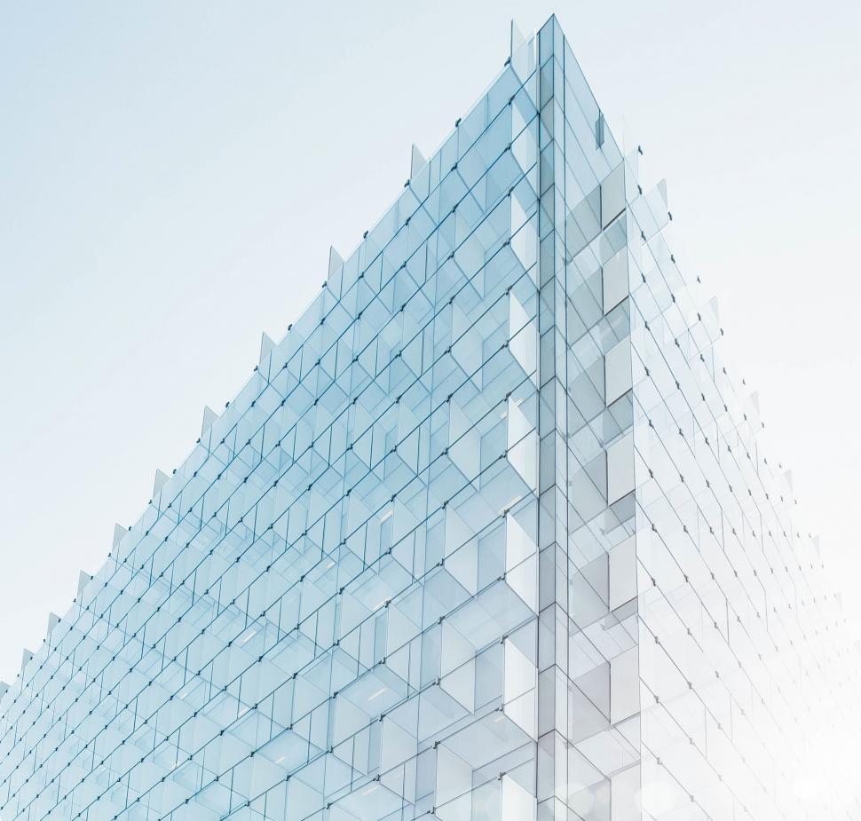 Free Image of Modern glass building facade with repeating patterns. 