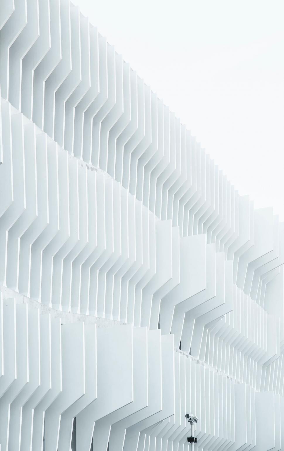 Free Image of White building facade with geometric protruding panels. 