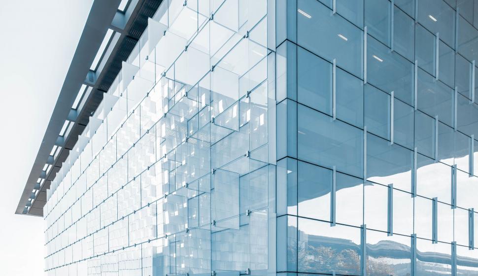 Free Image of Modern architectural glass building with reflections. 
