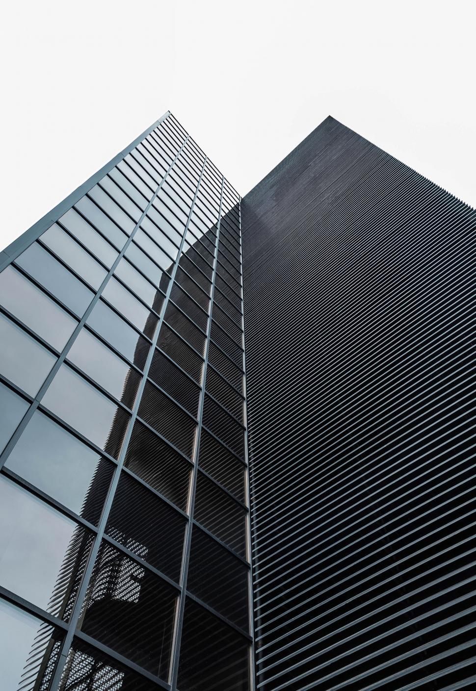 Free Image of Tall modern skyscraper with sleek black glass windows 
