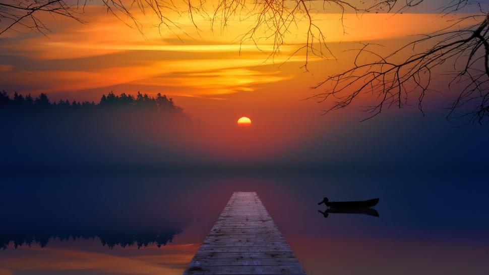 Free Image of Serenely stopping at wooden pier during sunset on lake. 