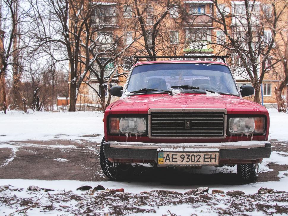 Free Image of Red vintage car in wintery environment with snow. 