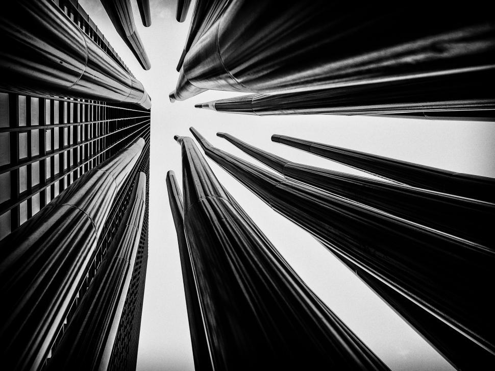 Free Image of Black and white upward view of modern urban scenery. 