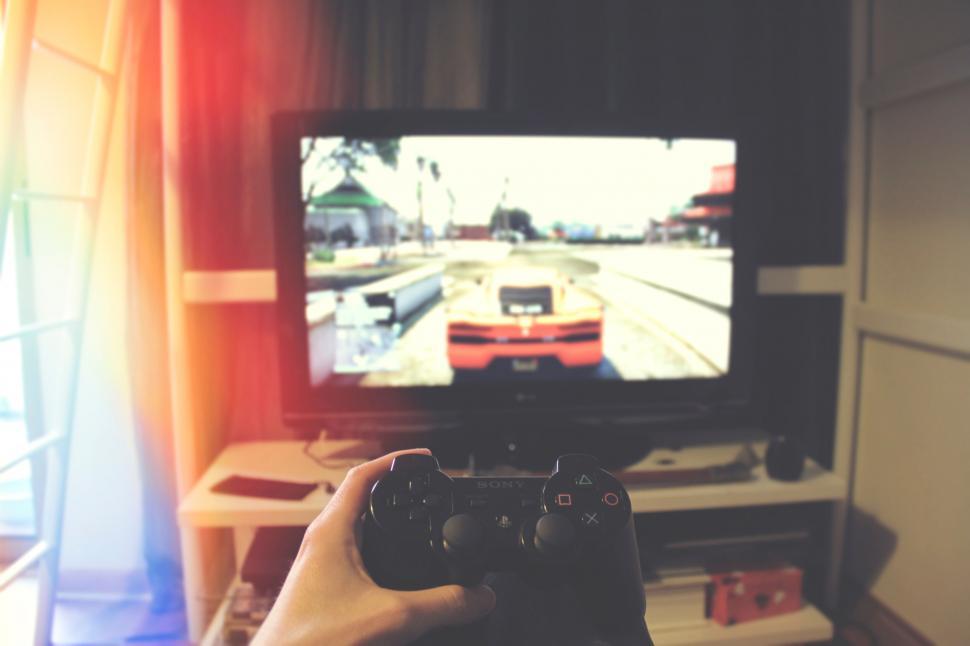 Free Image of Person playing a video game on a television screen 