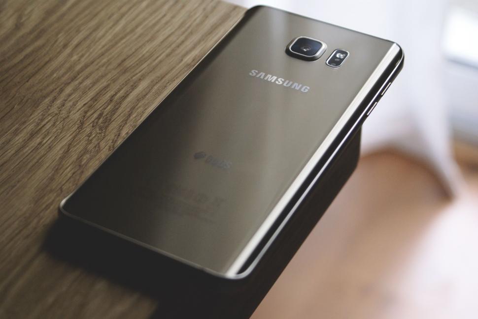 Free Image of Samsung smartphone with reflective gold back cover 