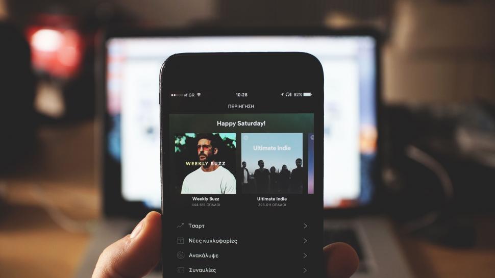 Free Image of Smartphone displaying music app in casual environment 