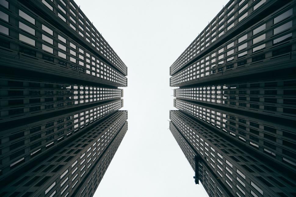 Free Image of Symmetrical high-rise buildings shot from below 