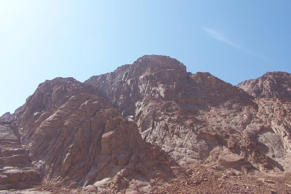 Free Image of Rugged barren mountains with clear daytime blue sky. 