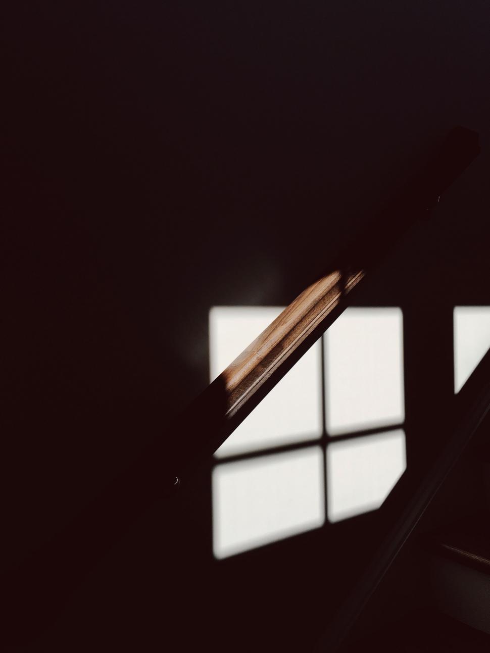 Free Image of Shadowed staircase with window light pattern scene 