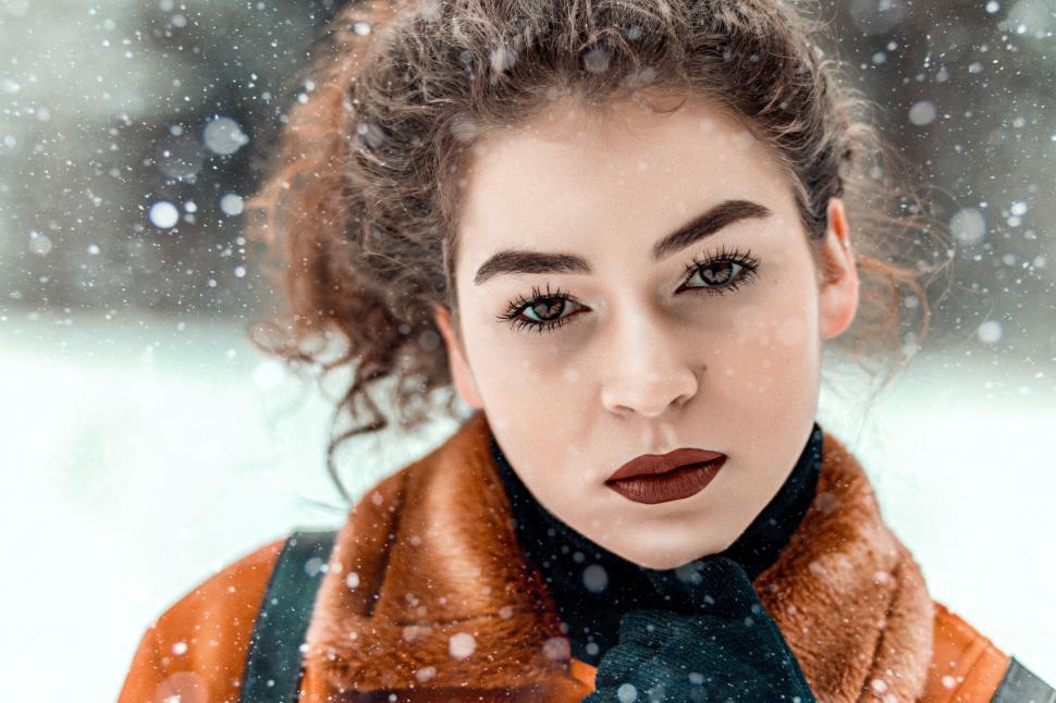 Free Image of Winter scene with person wearing warm clothing and snow 