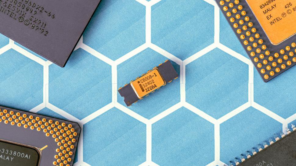 Free Image of Collection of microchips on hexagon-patterned surface. 