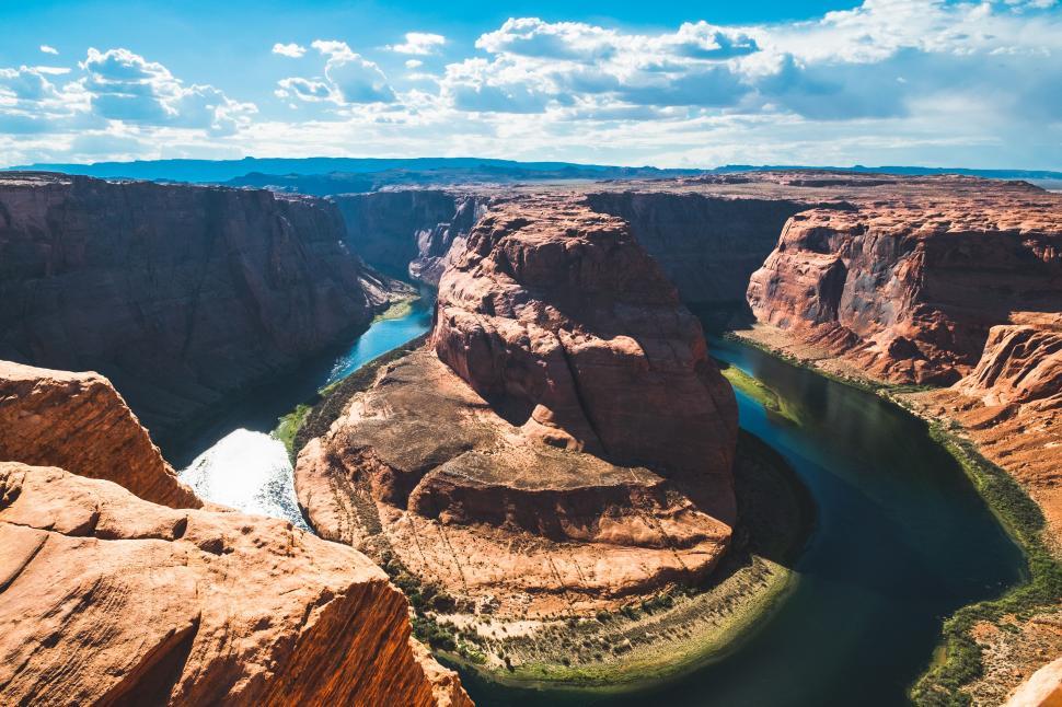 Free Image of Aerial view of a river winding through desert canyon 