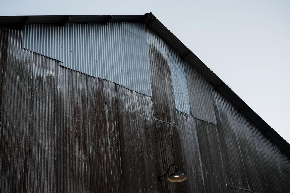 Free Image of Old metal building exterior with rustic, worn textures. 