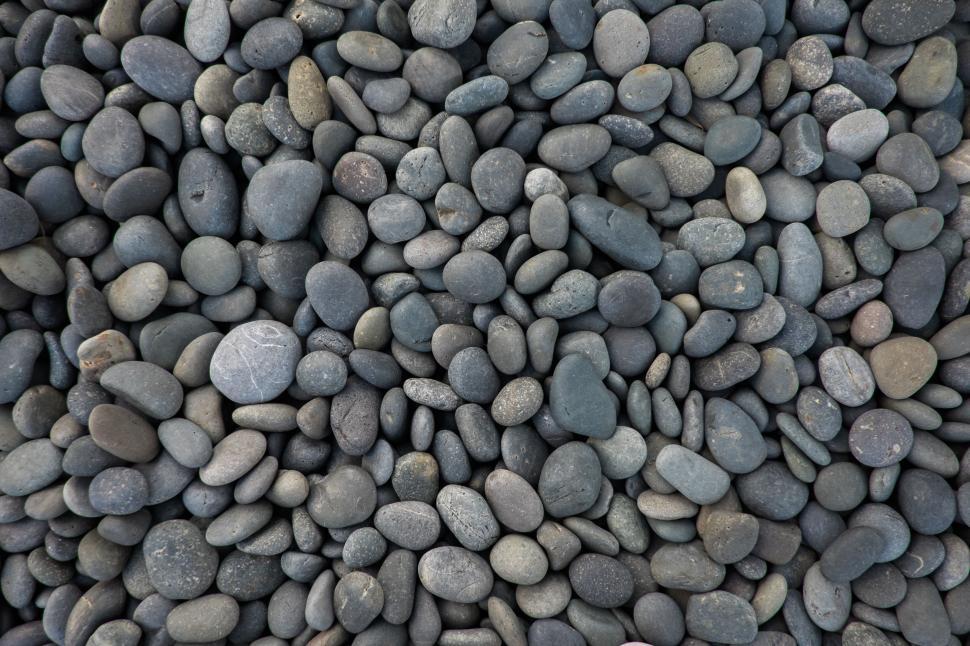Free Image of Close-up of smooth, rounded pebbles in varying colors. 