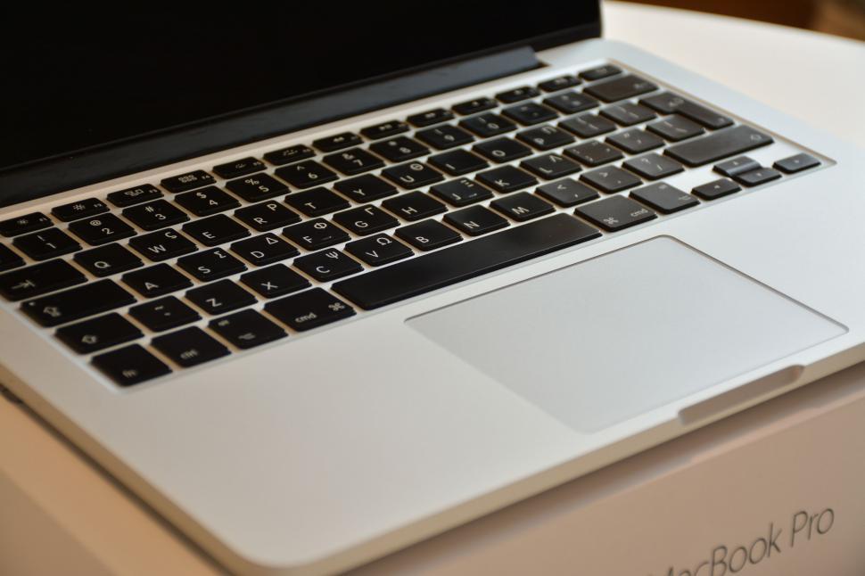 Free Image of MacBook Pro keyboard with a focus on sleek design 