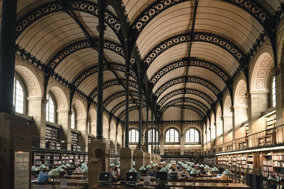 Free Image of Large library with arched ceiling filled with books 